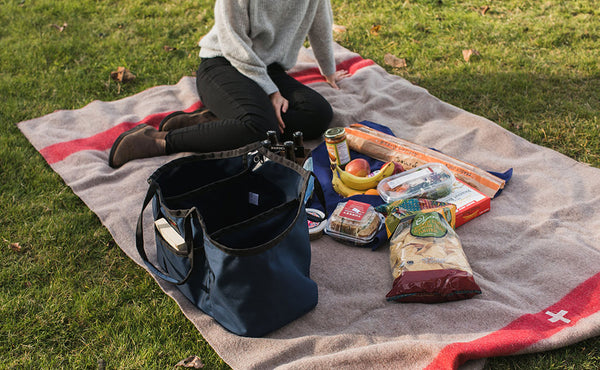 A person setting up a picnic with a Monster Truck.